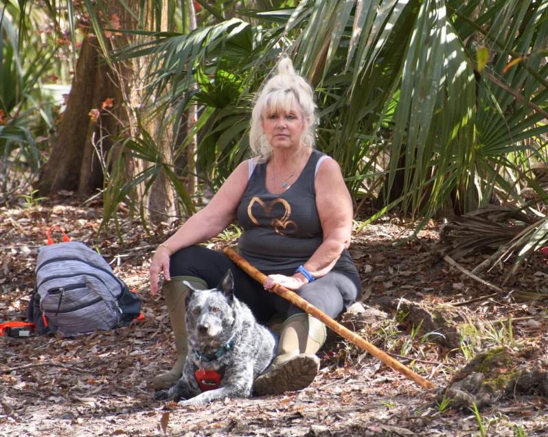 Rebecca Rollyson and her dog Teddie on the trail